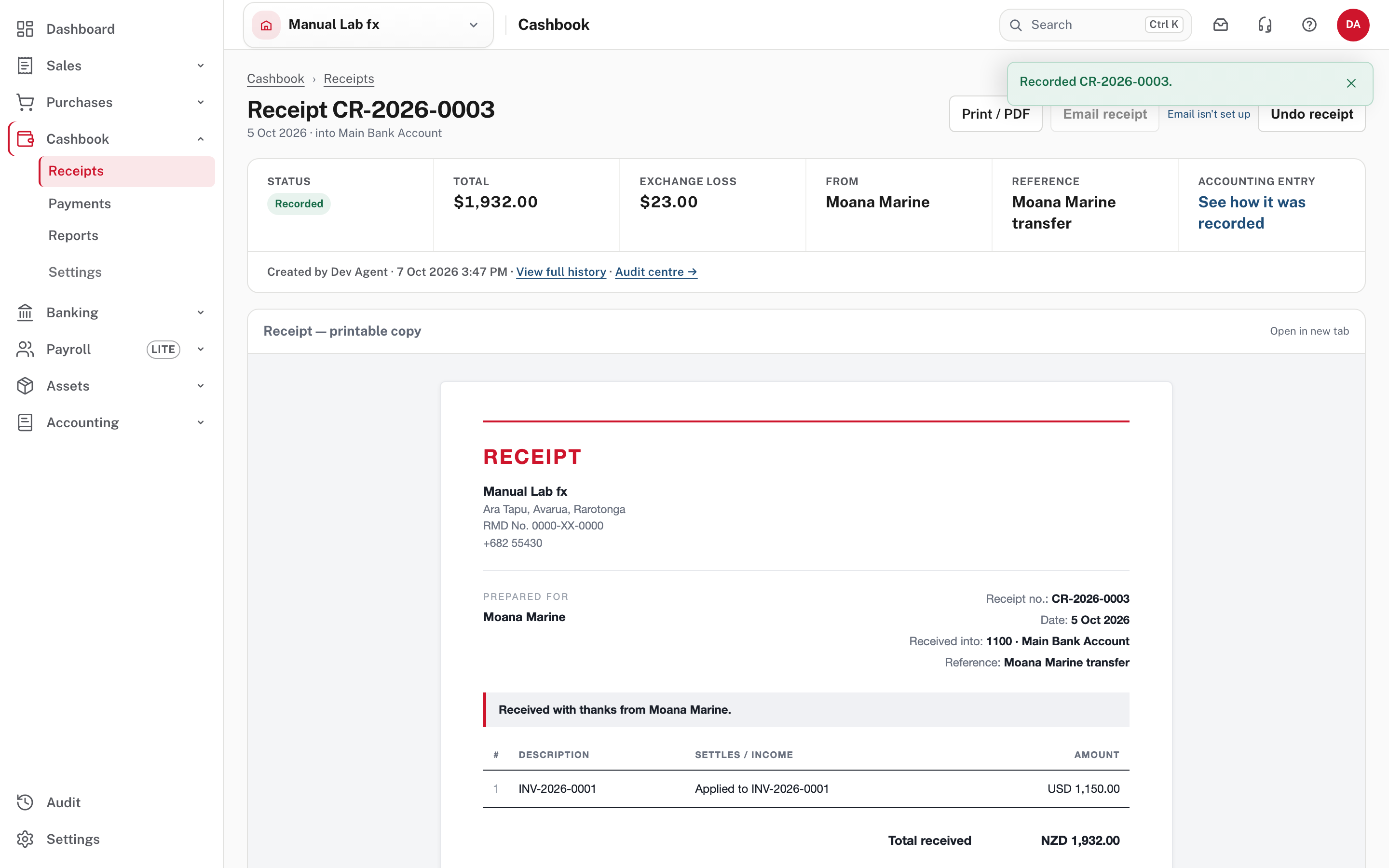 The recorded receipt: total $1,932.00 and an exchange loss of $23.00